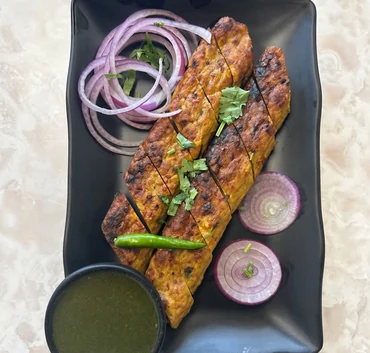 Chicken seekh kebabs with onions and green chutney at Lutf Indo-Pak Cuisine
